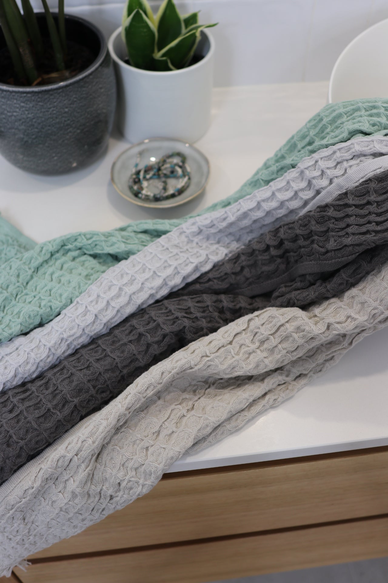 waffle hand towels in 4 colours on a vanity